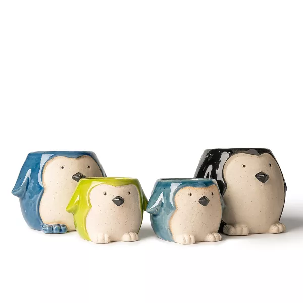 ຜູ້ຖືທຽນທີ່ມີຮູບຊົງ penguin